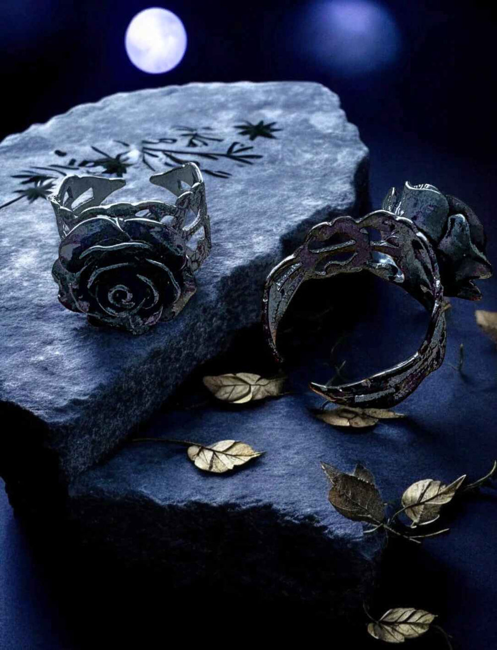 Schwarzer Rosenring auf grauem Stein mit floraler Verzierung – romantisch-dunkles Fantasy-Setting