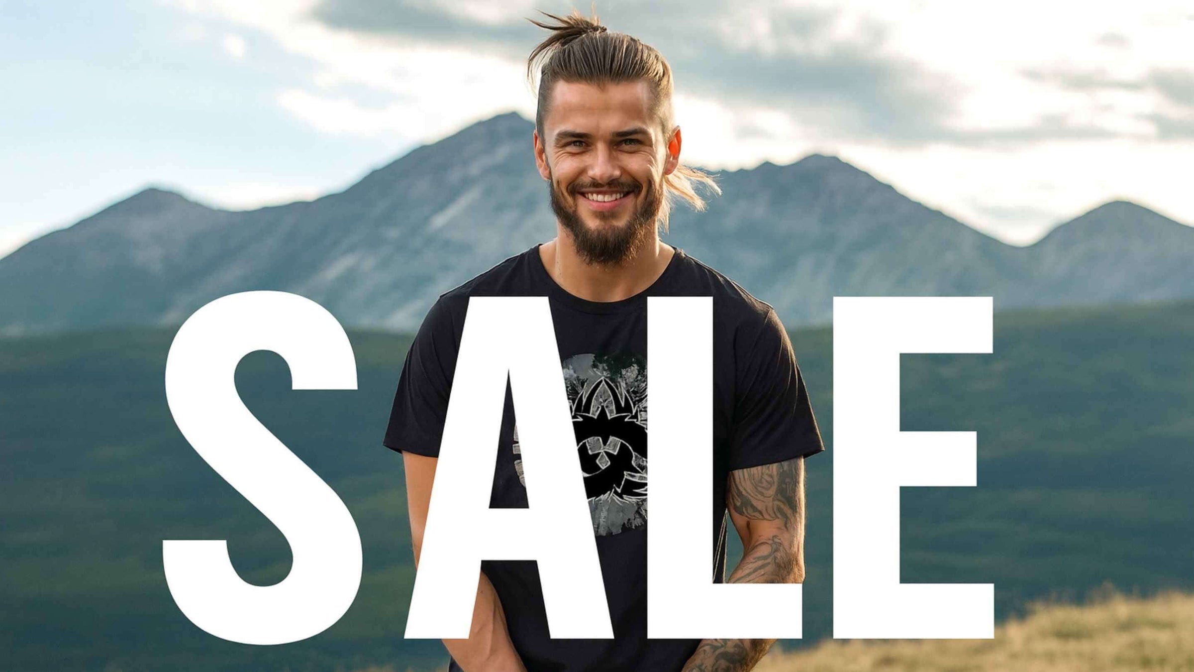 Herren Shirts im SALE Kategoriebild. Ein Mann im Runental Look, steht von einer mystischen Gebirgskette.