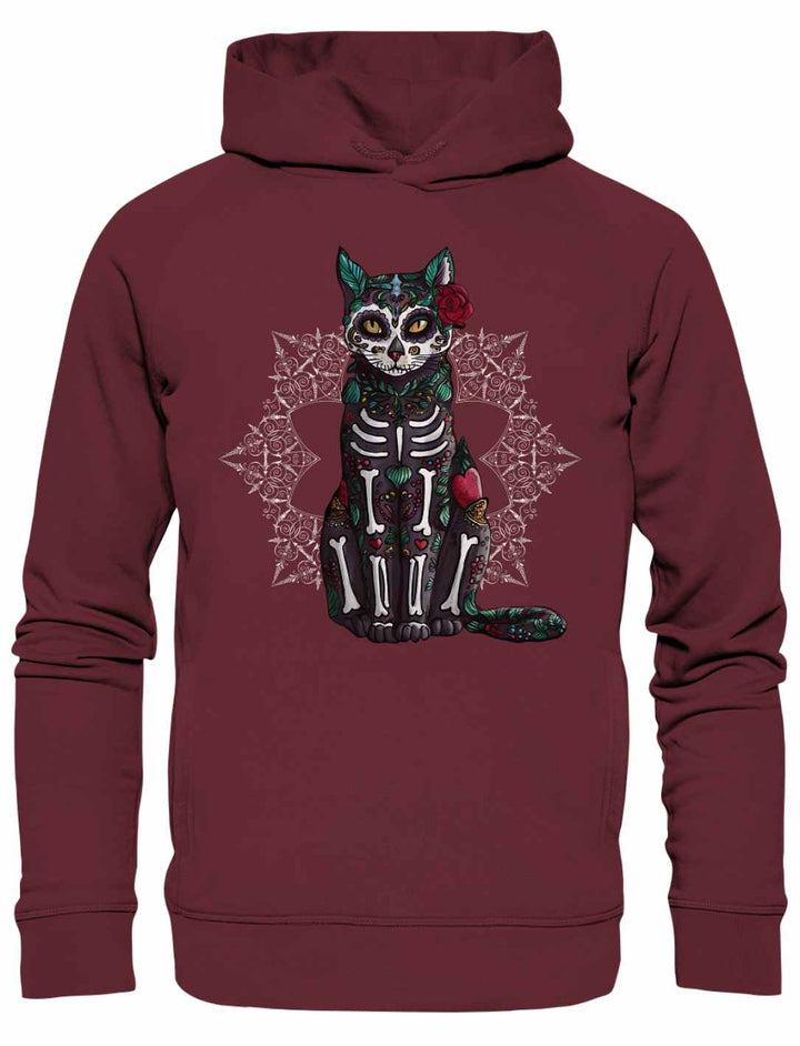 Ein burgunderfarbener Catrina Felina Unisex Hoodie mit kunstvollem Katzen-Design inspiriert vom Día de los Muertos, abgebildet auf weißem Hintergrund.